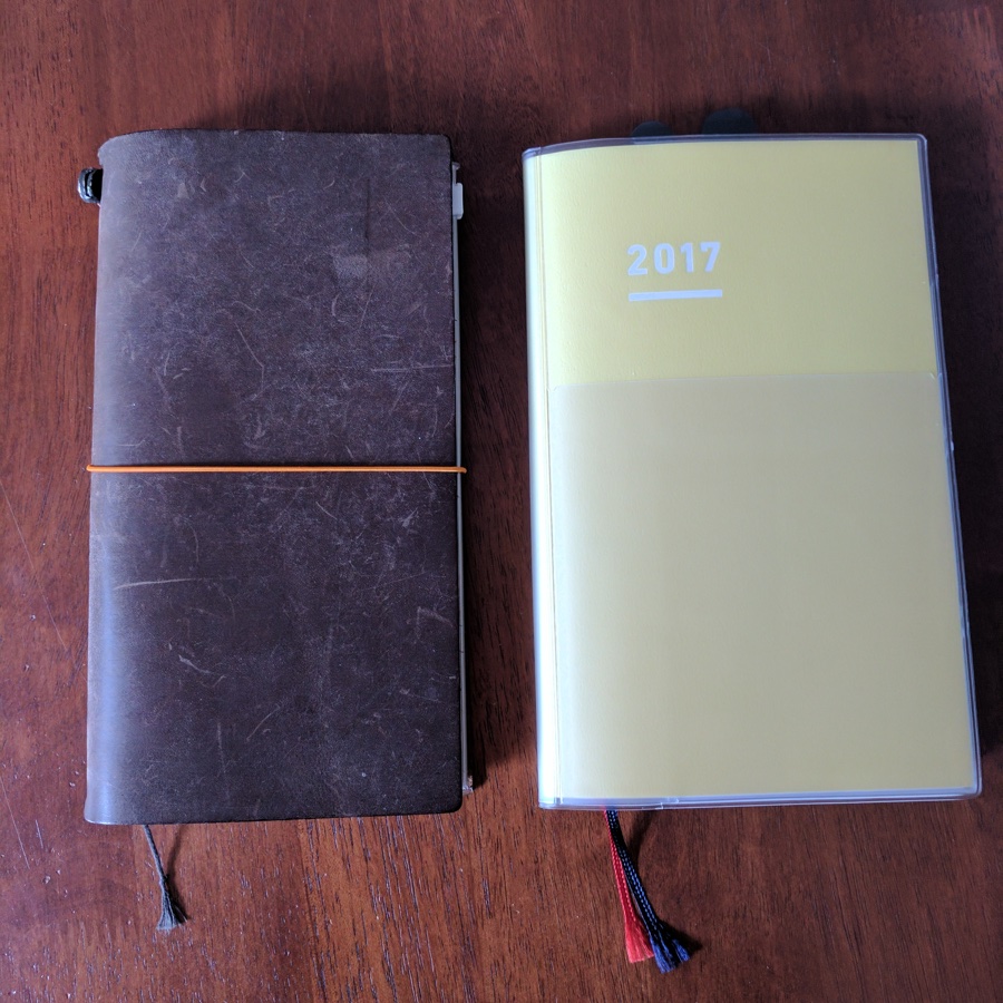 Jibun Techo A5 slim next to Regular Traveler's Company Notebook